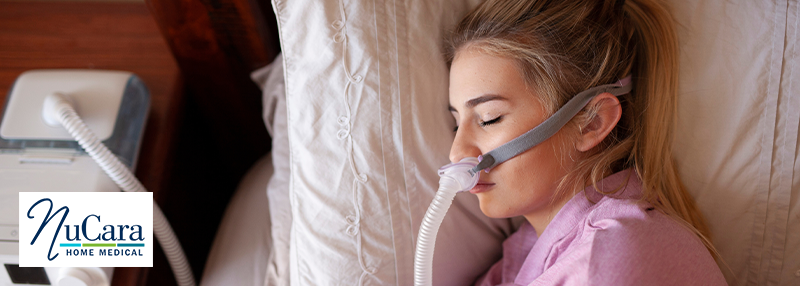 Woman using CPAP machine Sleep Apnea