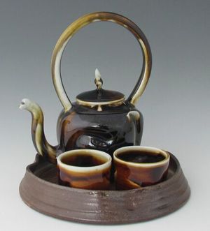 karen-hembree-tenmoku-altered-teapot-bowls-with-tray-soda-fire.jpg