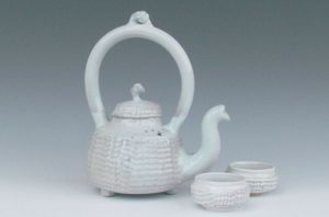 karen-hembree-nuka-glazed-teapot-and-bowls-soda-fire.jpg