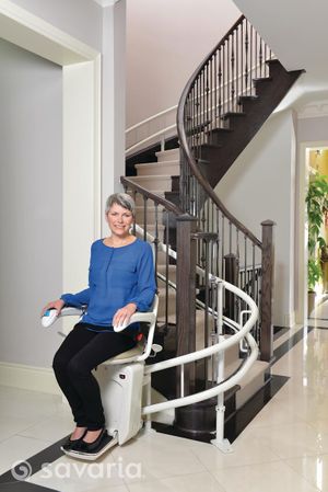  Savaria Stairlift On Curved Stairs At Bottom Of Staircase