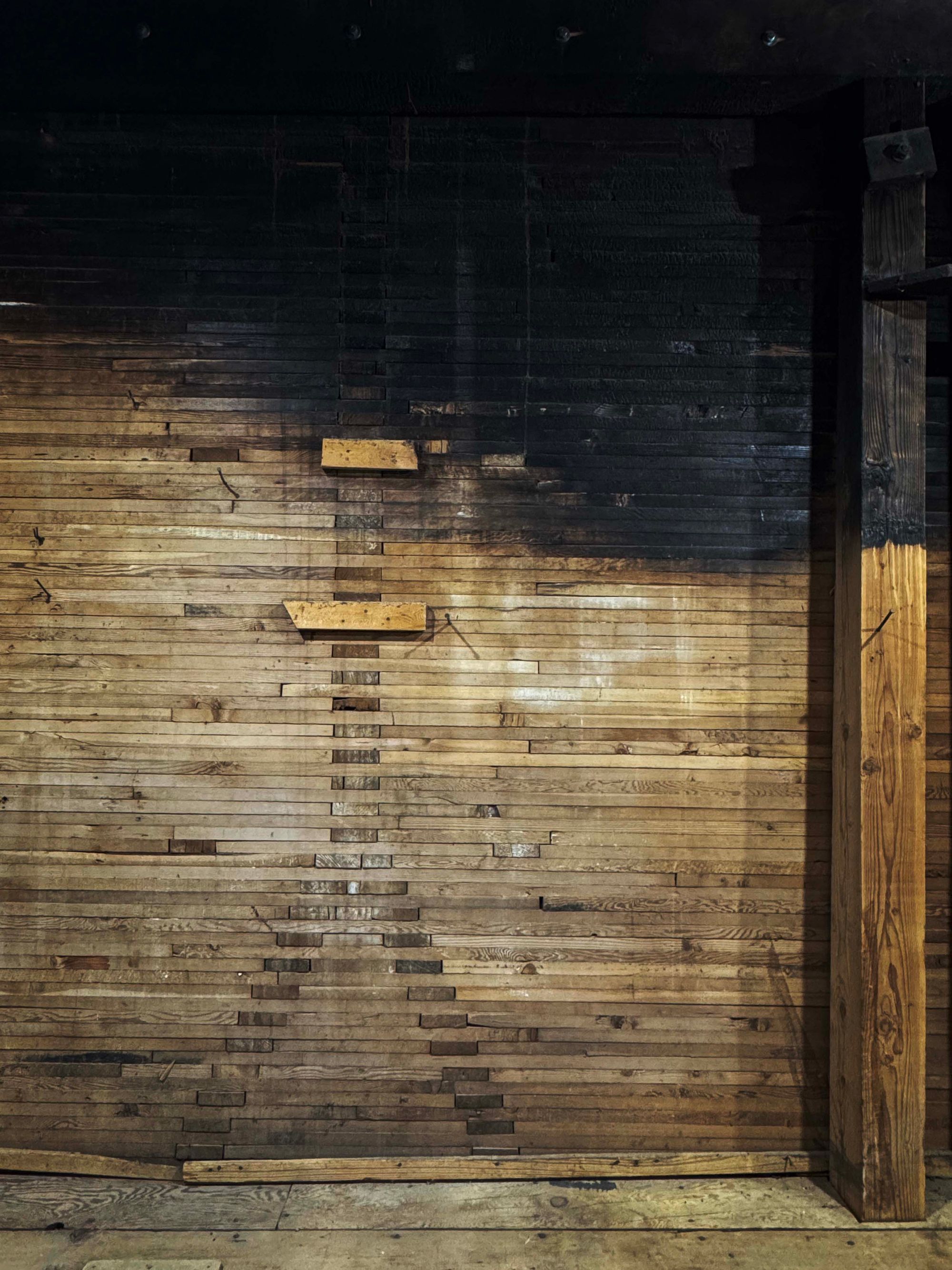 Stacked plank construction inside the walls of the grain elevator at the Grain Yard StackedWoodY_6063.jpg