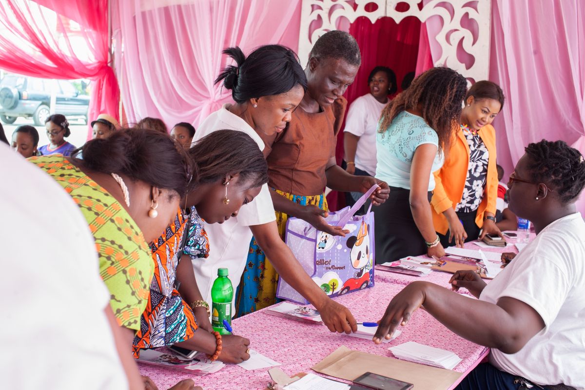 The first patient navigator in Nigeria helps women register for the Run For a Cure Africa free breast screening at Shoprite, Ikeja City Mall, Lagos. June 2016