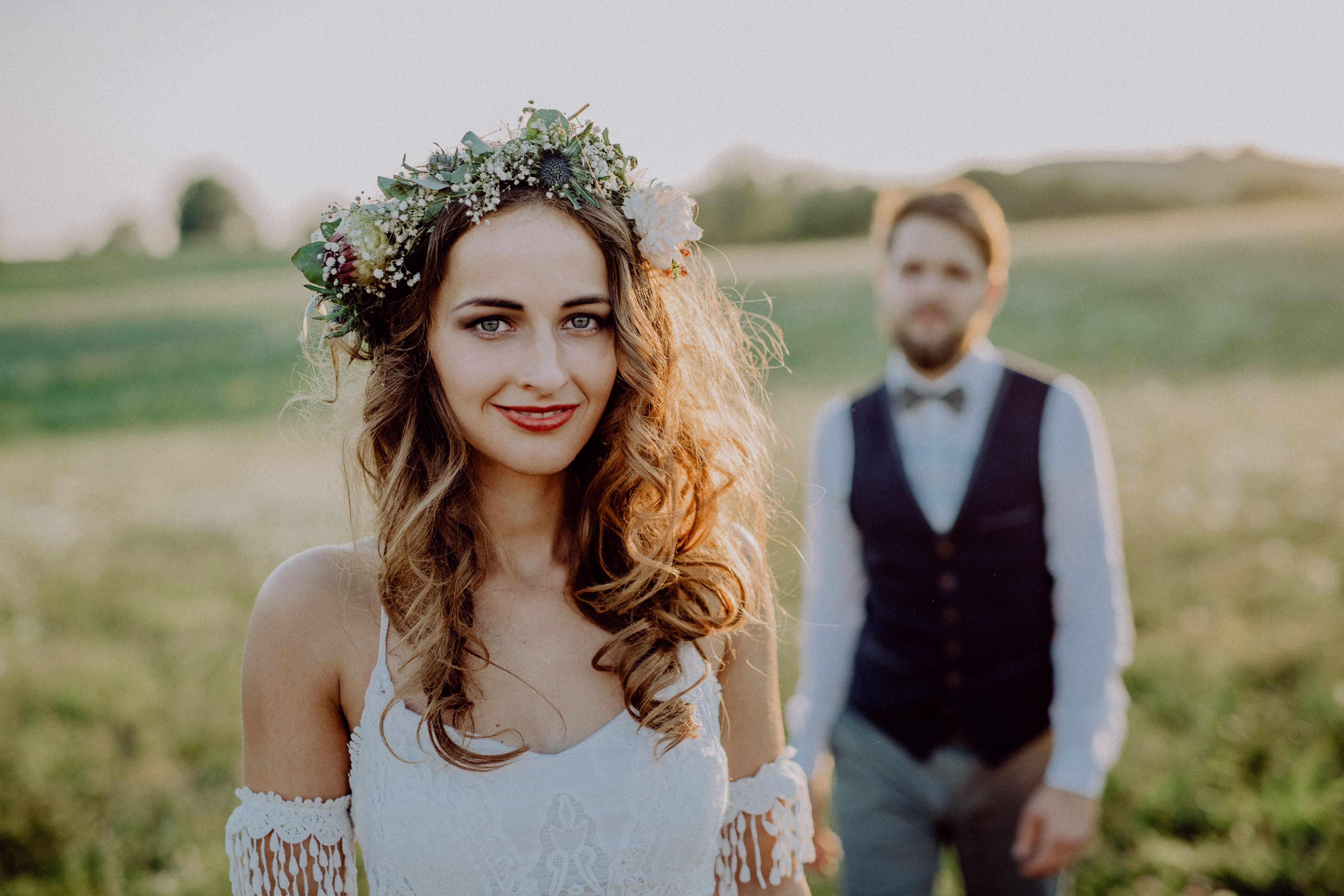 beautiful-bride-and-groom-at-sunset-in-green-natur-PG3HH65.jpg