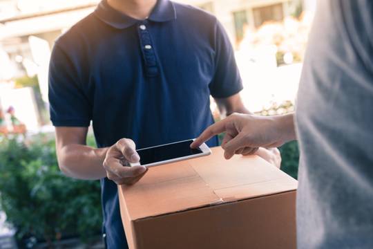 Image of someone receiving a package delivery