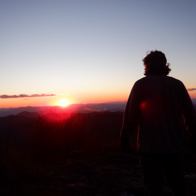 Teen experiencing personal growth at summer camp for troubled youth wilderness therapy hiking north carolina