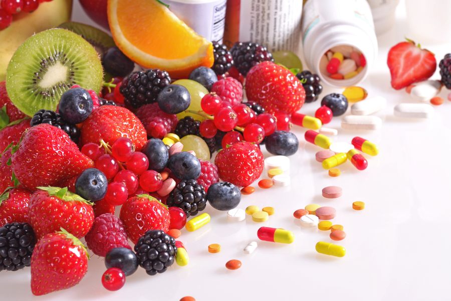 Variety of fruit and supplements Vitamins & Supplements
