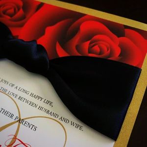 deep red roses with black satin ribbon