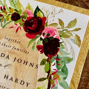 rustic wood, greenery with red and pink florals