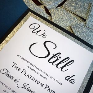 vow renewal in black, white and silver glitter with black folder