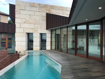 Racae Meyer - 65 Balcony - looking at pool and art through windows.jpg