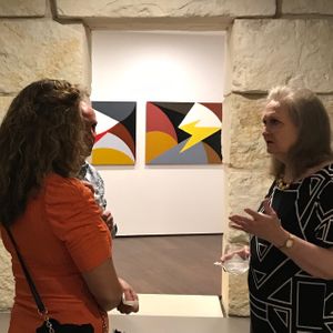 Racae Meyer - 72 Racae talking with Art Alliance guests in front foyer with Tuscany & Umbrias in background.jpg