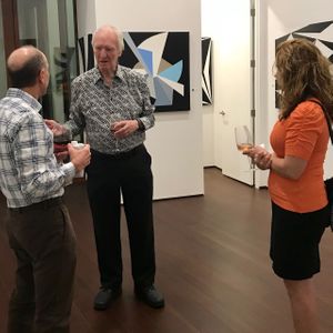 Racae Meyer - 57 Erwin talking with Art Alliance couple in Black & White space.jpg