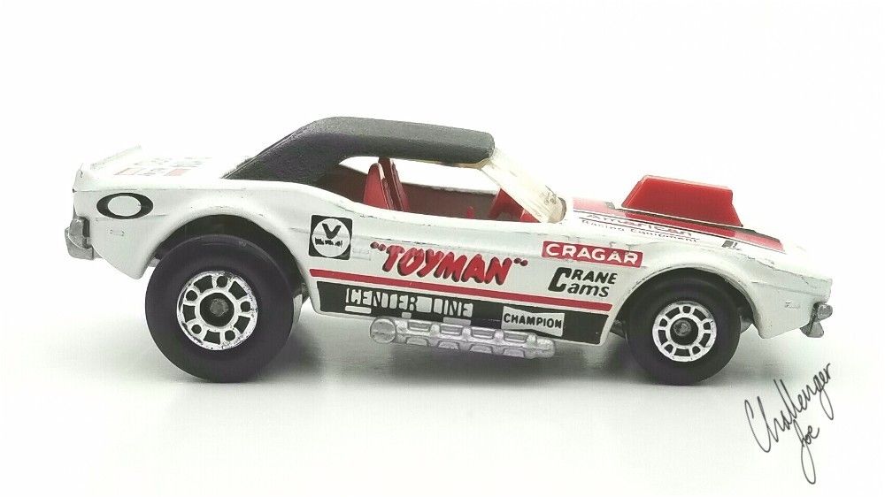 Passenger side view of the Matchbox White Toyman Challenger MB White Toyman PS