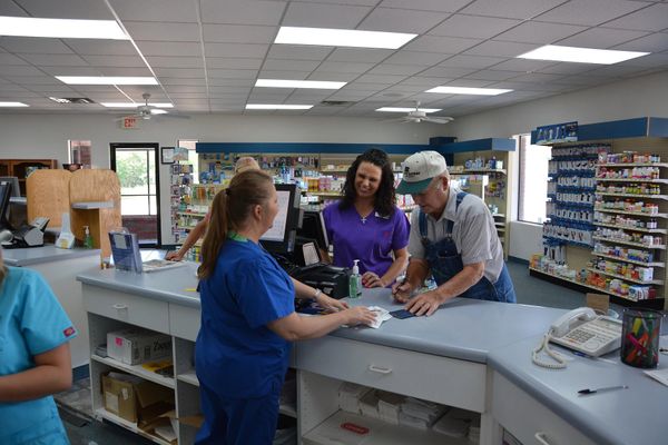 Pharmacy Staff with Customers.jpg