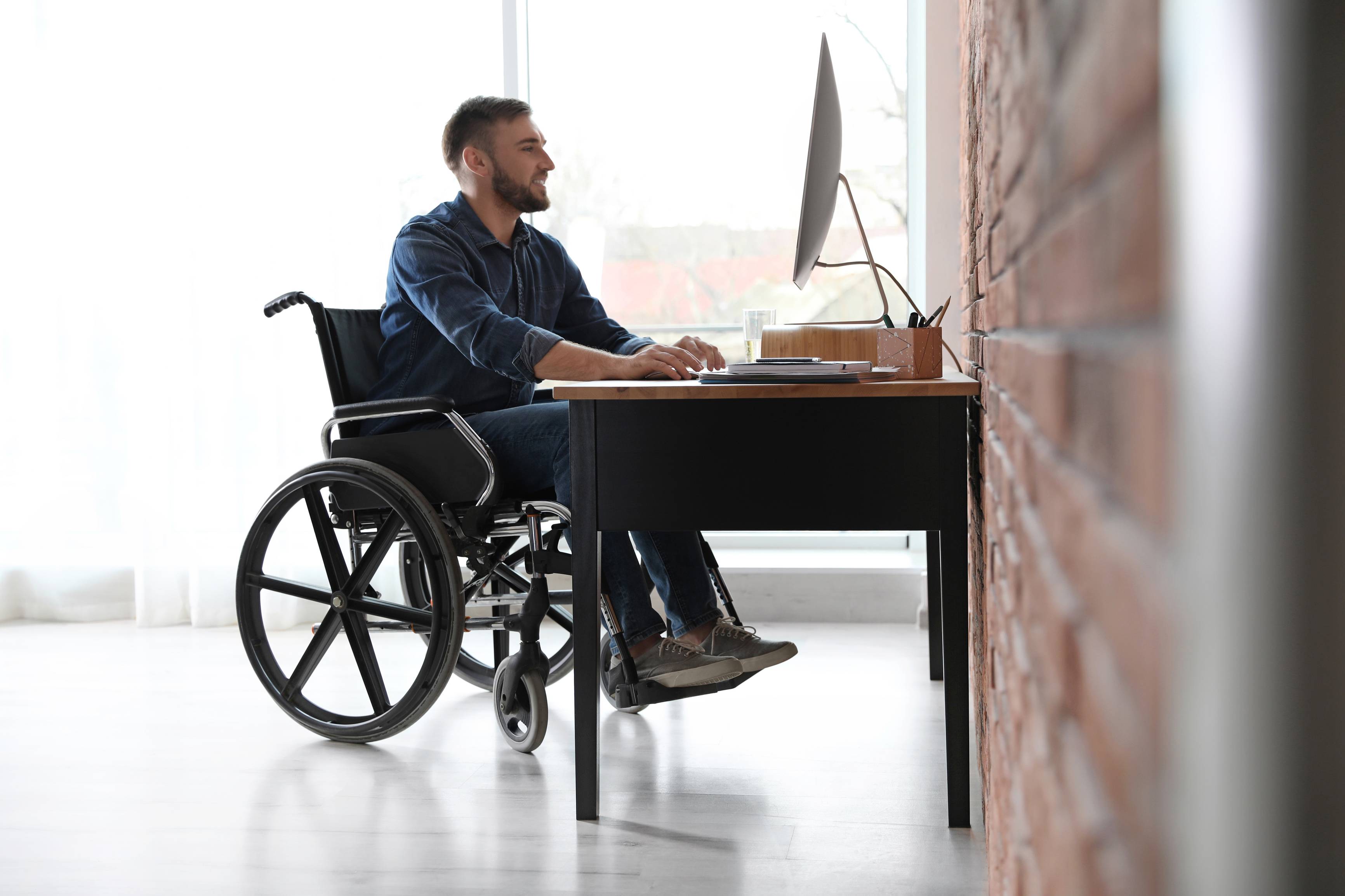 Man working using a wheelchair DME