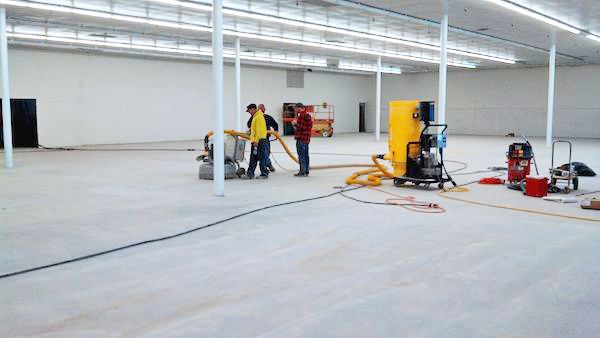 Our Ohio Concrete team preparing a floor grinder for leveling a slab. Using diamond grinding equipment and HEPA vacuums, we can eliminate trip hazards (uneven joints or spalled areas) and expose aggregate if desired. This chemical-free, fume-free process leaves a clean, profiled surface ready for coating or finishing. Concrete-Refinishing.jpg