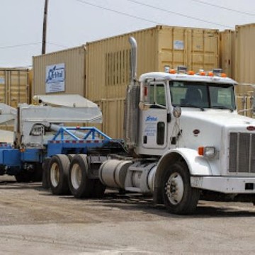 sideloader parked next to stacked containers
