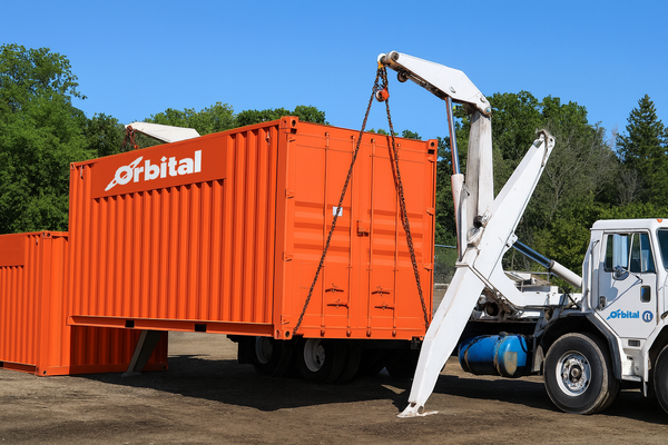 CM orange Orbital container with sideloader truck.png
