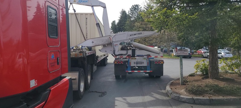 sideloader moving container from chasiss