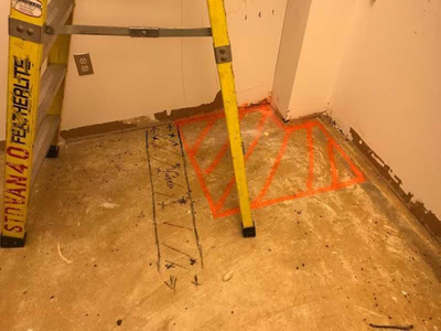 The picture shows the 3 conduits found marked with permanent marker. The orange paint is the area for saw cutting. green,oh2.jpg