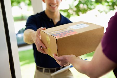A person delivers a package to someone