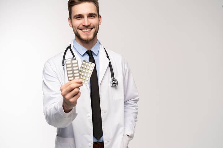 Pharmacist with pills