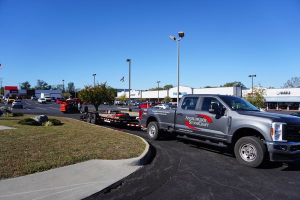 Commercial Stone Delivery Truck Transporting Large Boulder