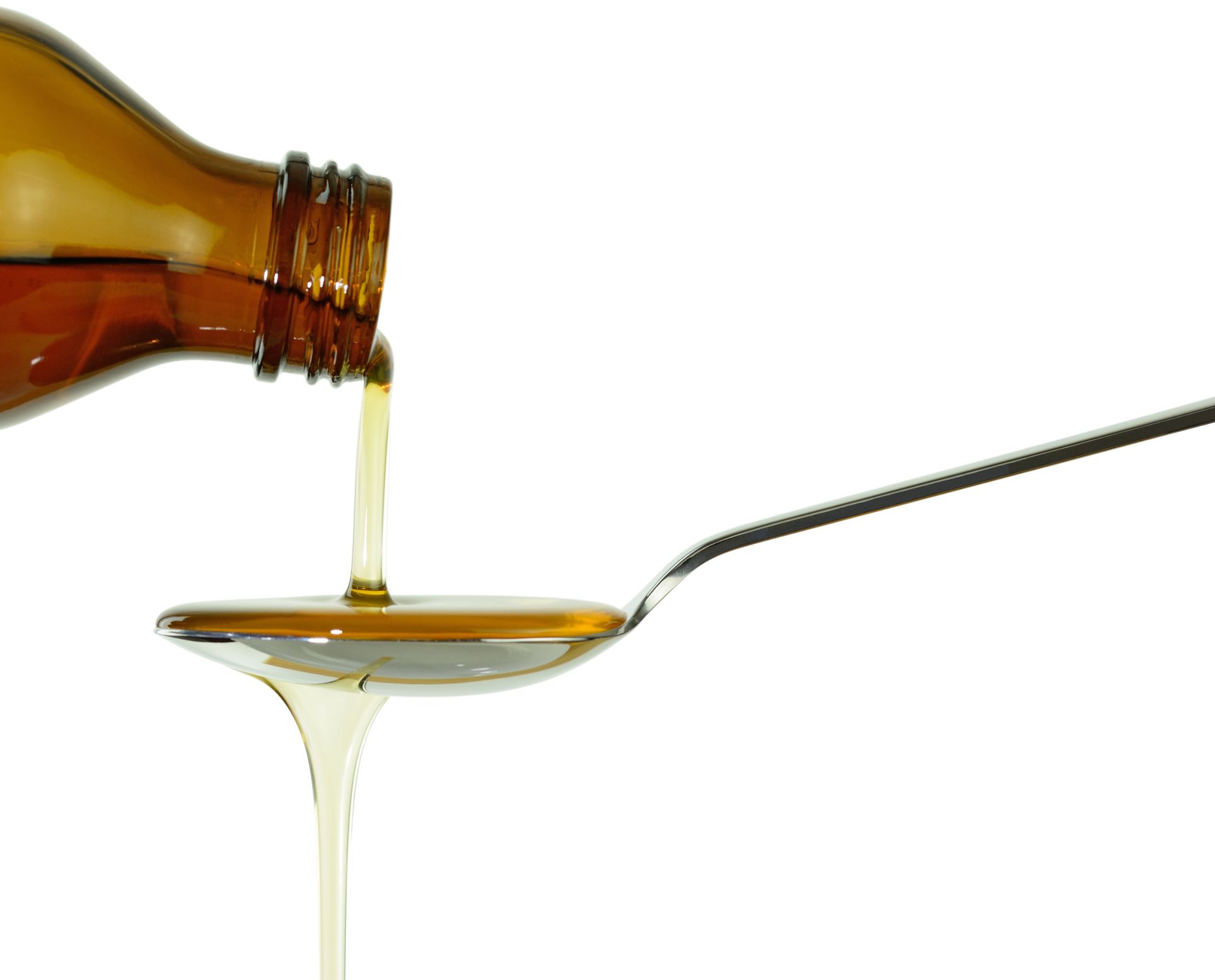 Liquid medication spilling over spoon Medication Flavoring