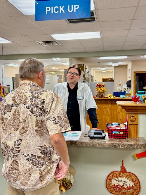 McAlester pharmacist helping customer