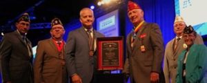 Berry Aviation COO, Sean Iverson (center left) accepts the Large Employer of Veterans Award from American Legion National Commander and his team at the national convention. Berry consistently hires and develops veterans for employment and growth.