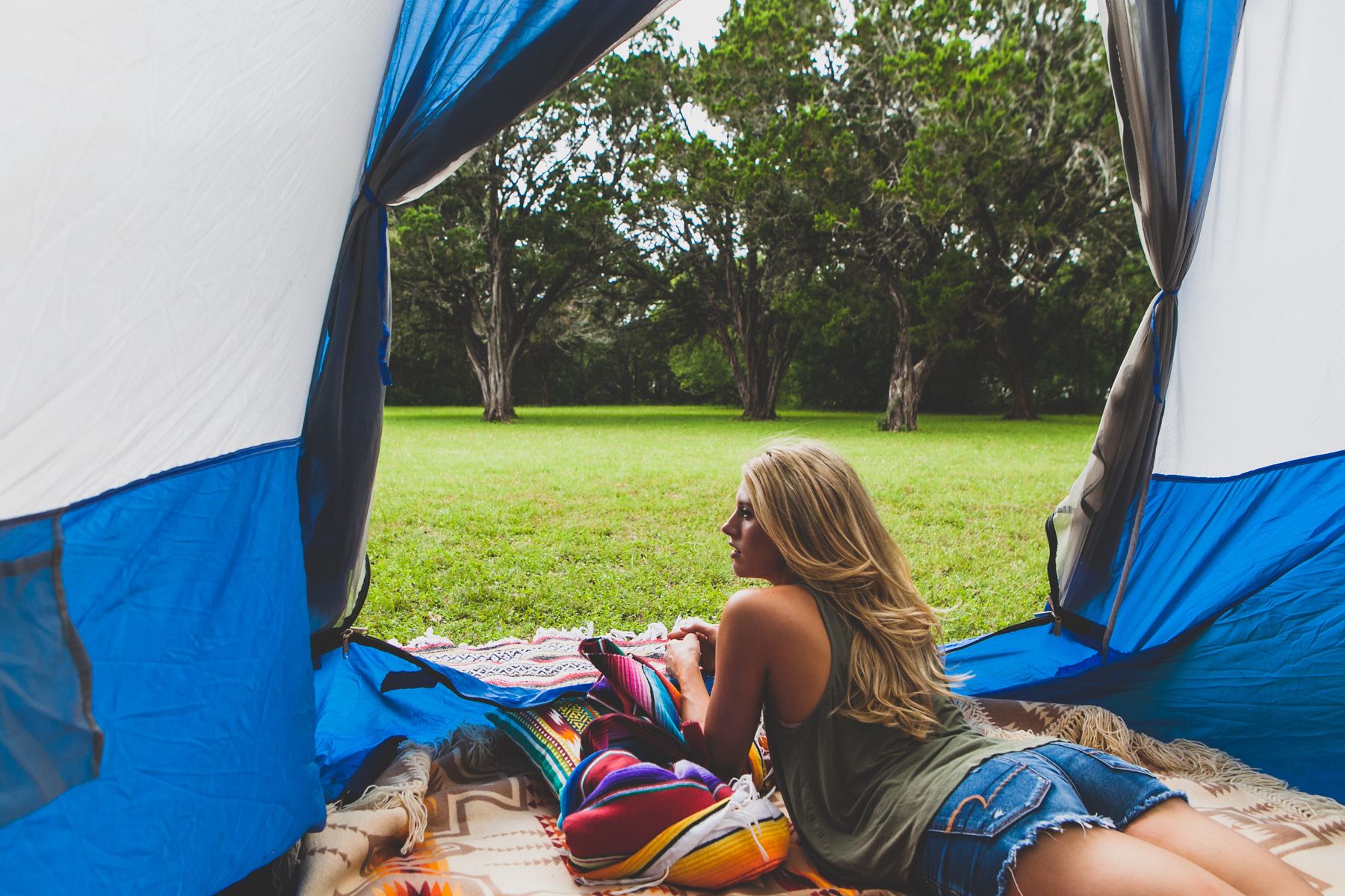 Girl in a tent glamping near guadalupe river