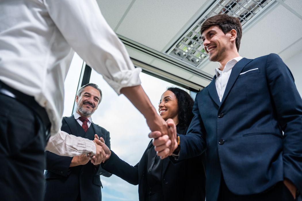 caucasian-businessman-making-a-handshake-together-2025-03-24-23-14-58-utc.jpg