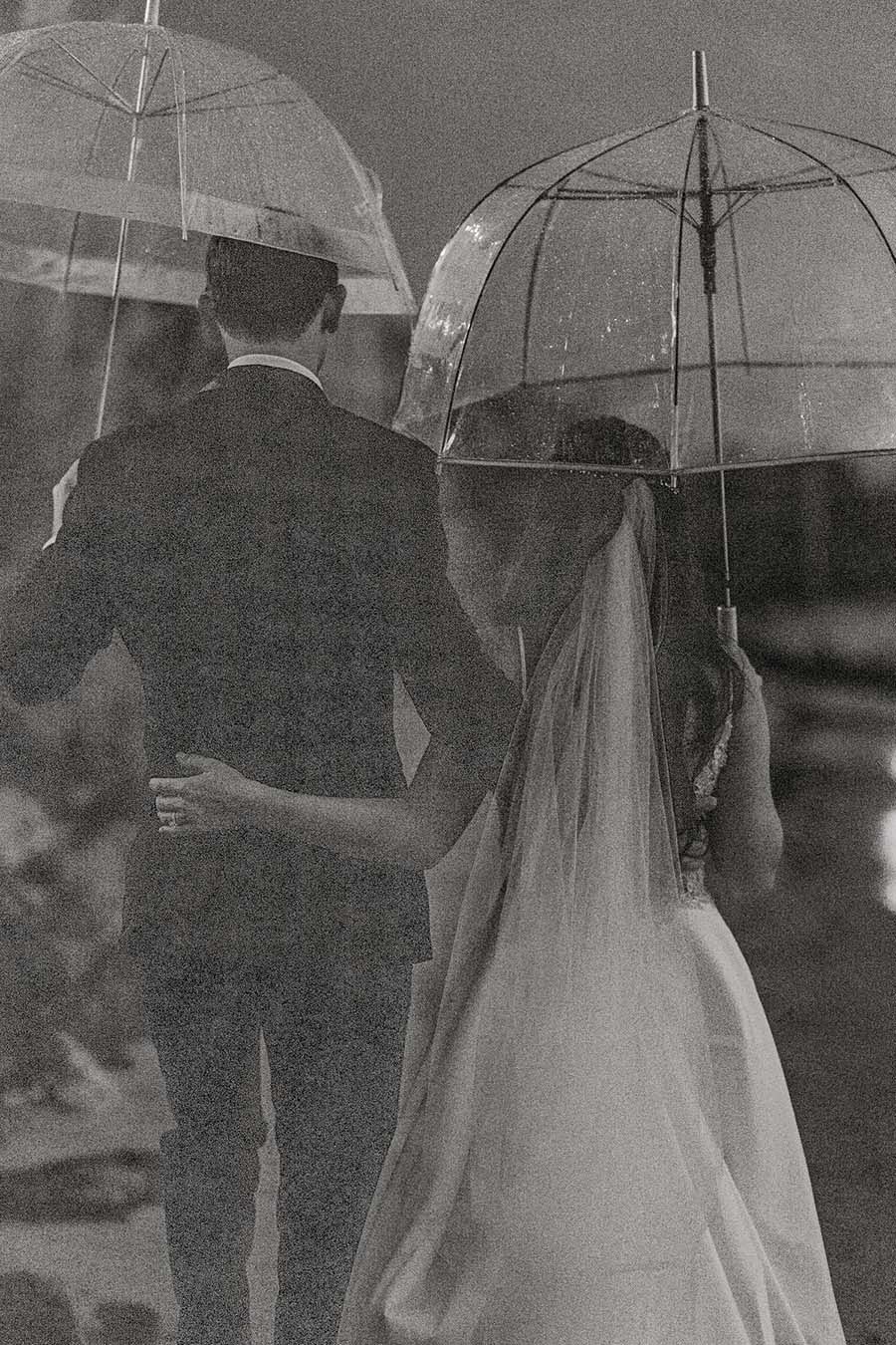 man and woman wedding umbrella photo