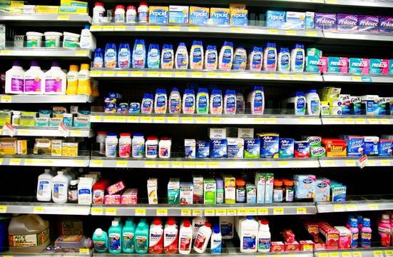 Pharmacy shelves lined with OTC products