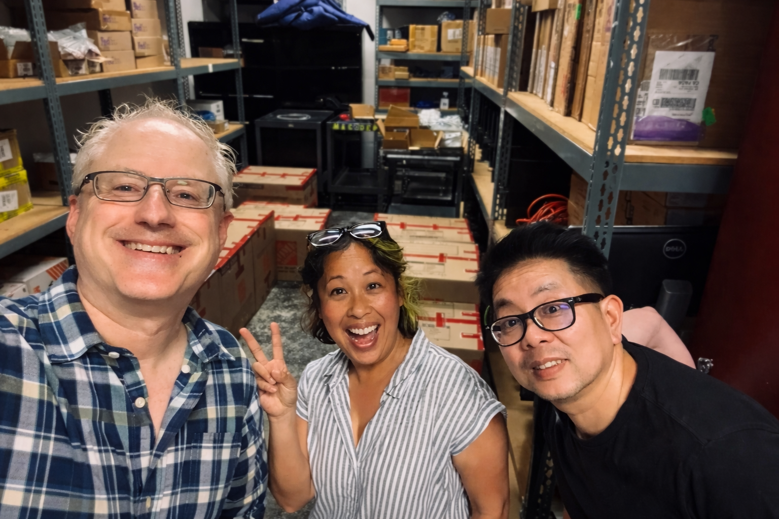 Happy coworkers in a storage room.png