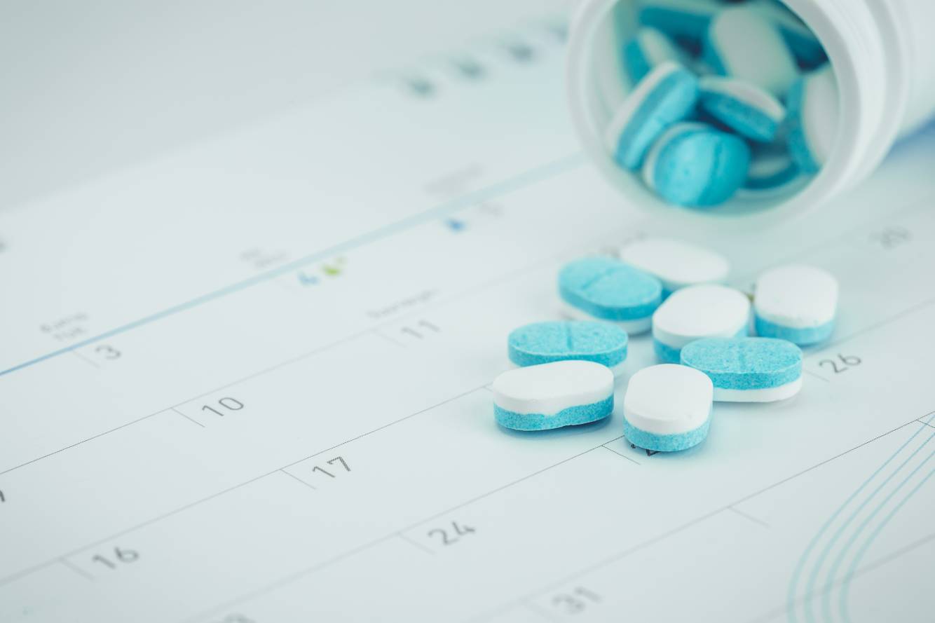 Image of medications spilled on calendar Medication Synchronization