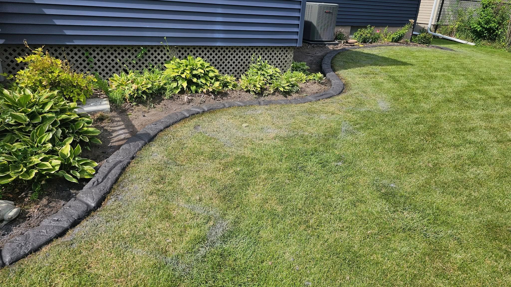 Border Magic Decorative Concrete Curbing Installed Around Flower Bed