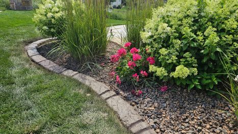 Installed landscape Border edging with flowers and greenery