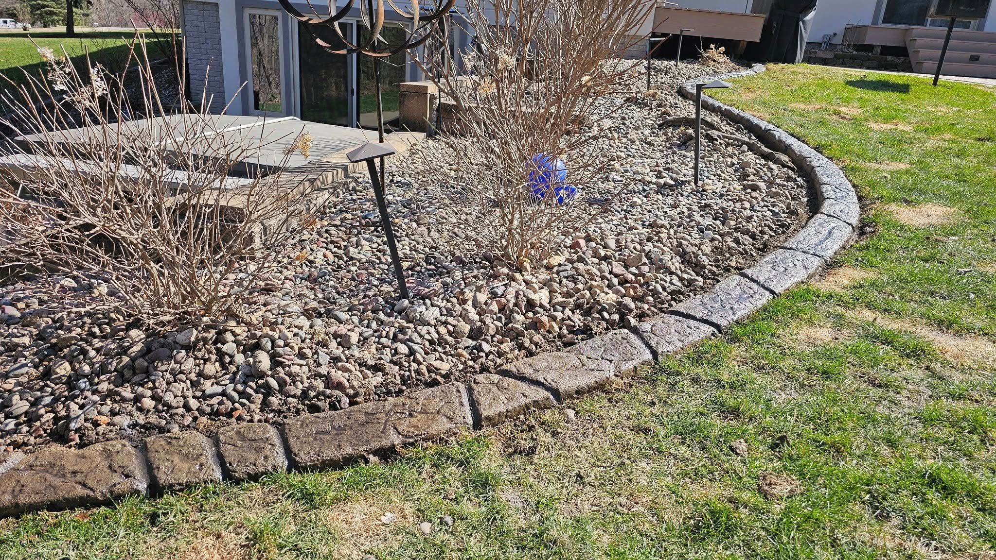 Border Magic Concrete Curbing Around Decorative River Rock Landscaping