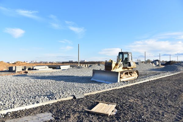 Grading Gravel on Commercial Construction Site