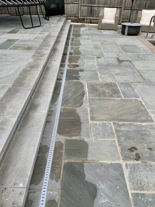 Installation Of Linear Drain System In Bluestone Patio