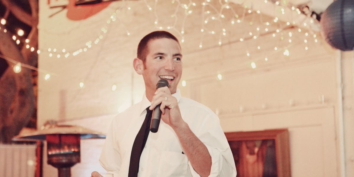 man giving a speech at wedding