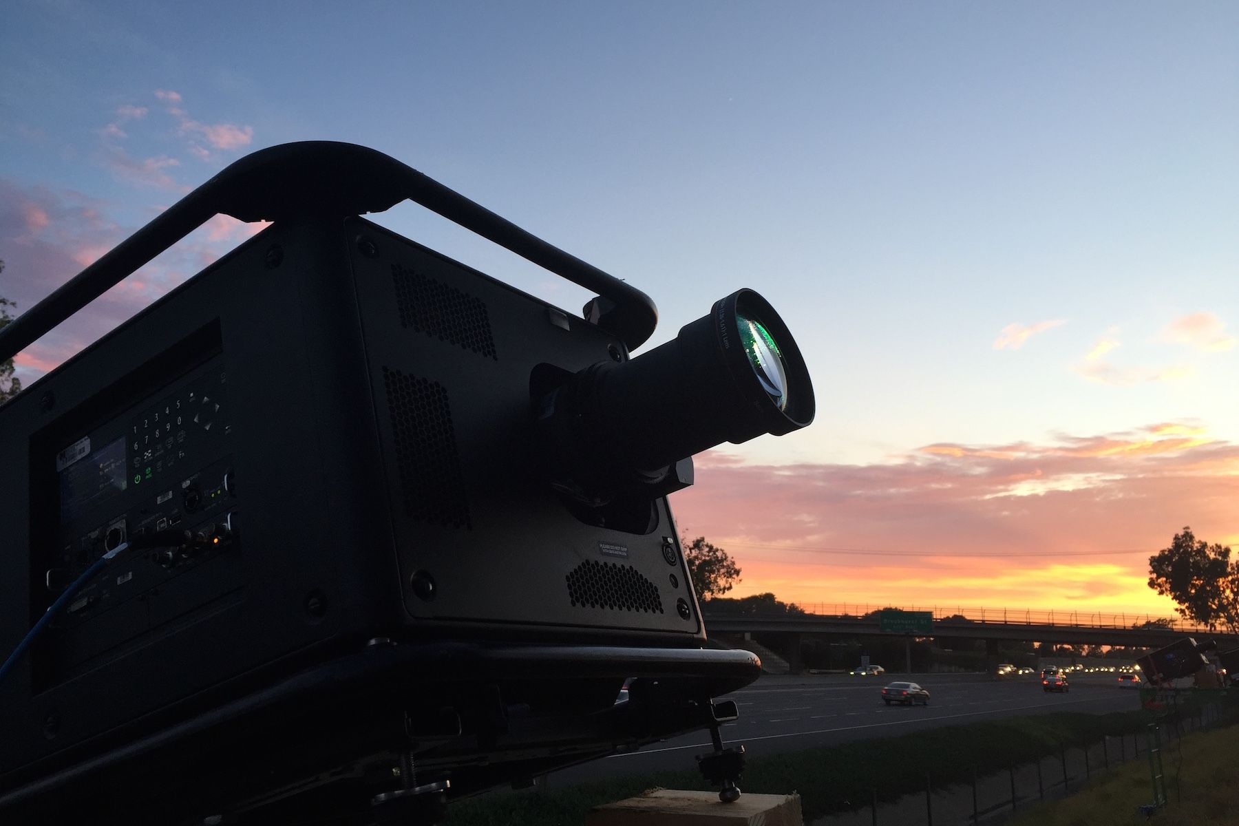 Silhouette of projector in sunset