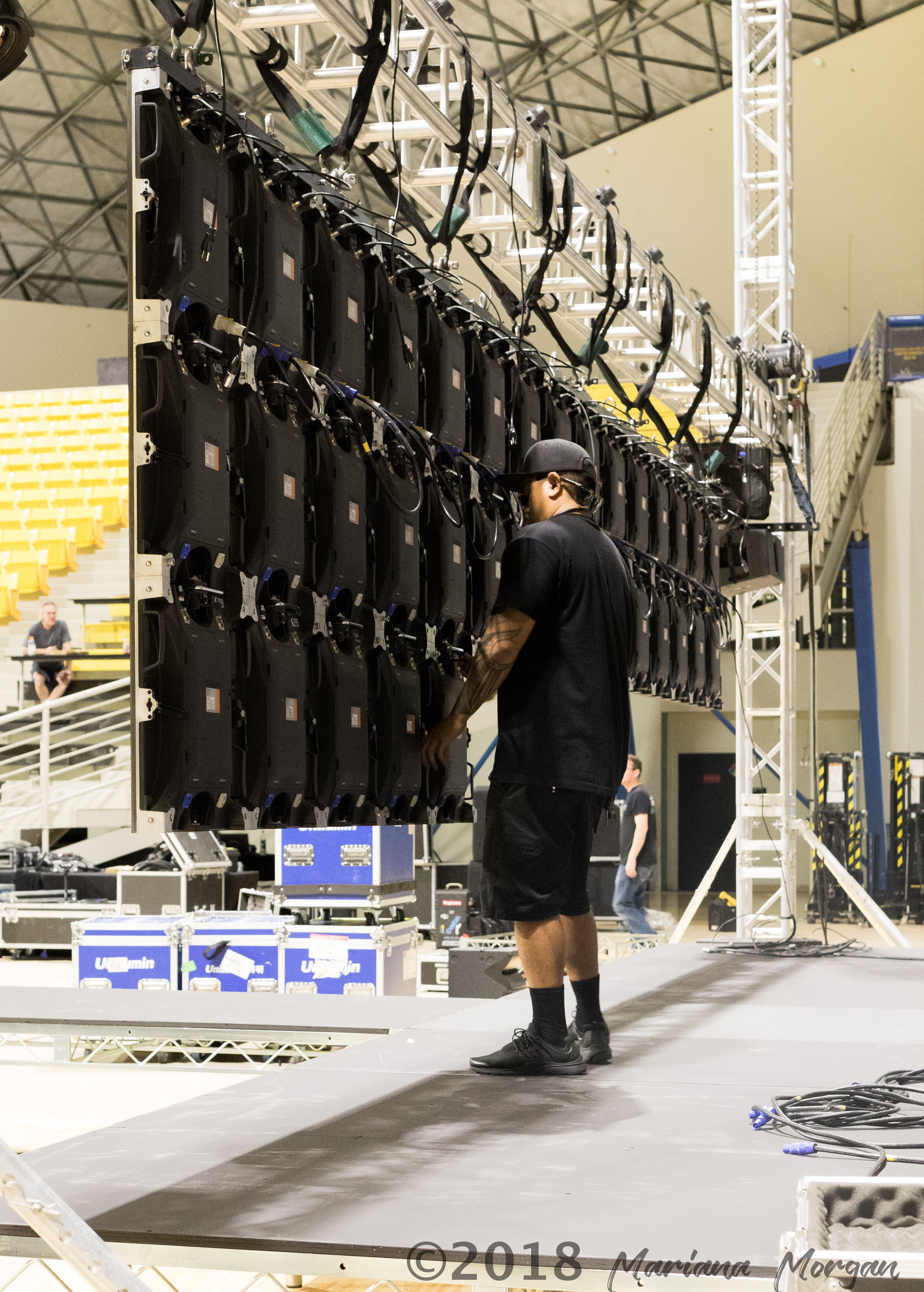 Tech setting up an LED Video Wall at Event