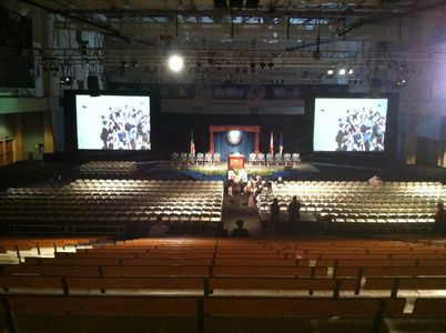 Graduation in Gym with two screens