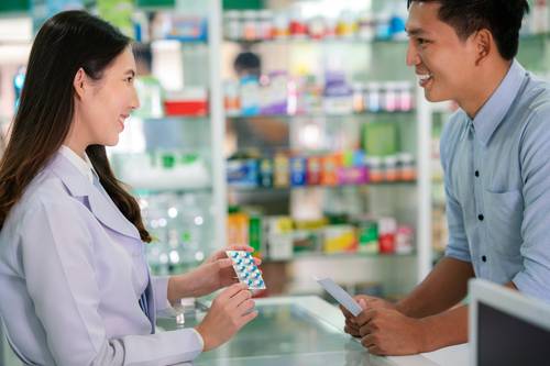 Pharmacist speaking to patient