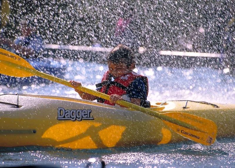 kid splashing in kayak.jpg