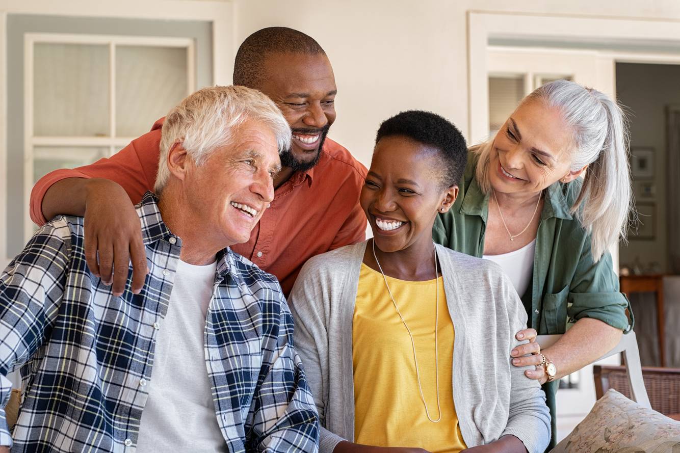 Group of older friends laughing together Medicare Open Enrollment