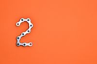 gray-steel-chain-on-orange-surface-1061141.jpg