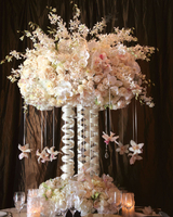 Unique floral centerpieces using roses and flowers. wedding planners floral centerpieces